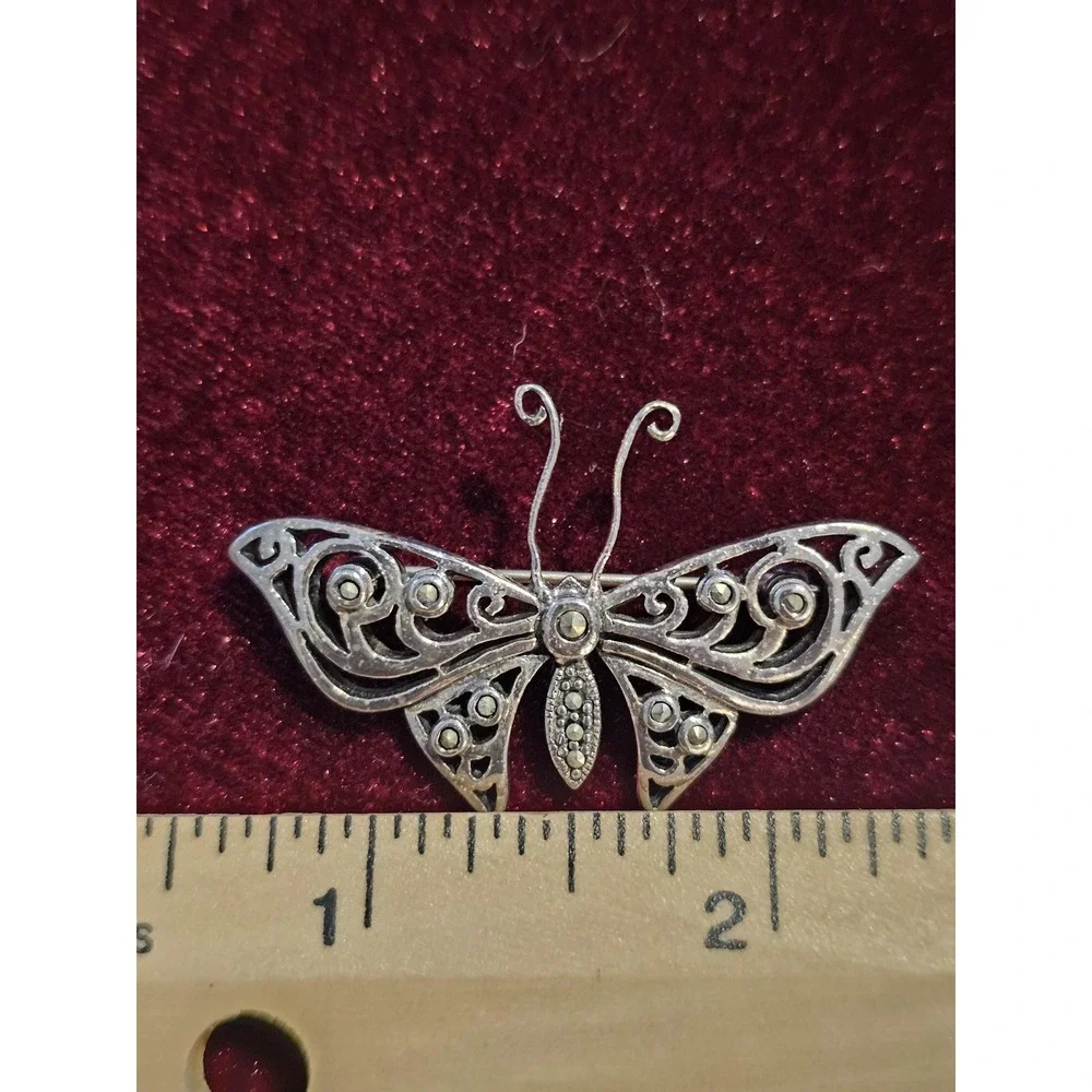 sterling butterfly pin. Marked 925 and hallmark CFT. About 1.5‎ brouch